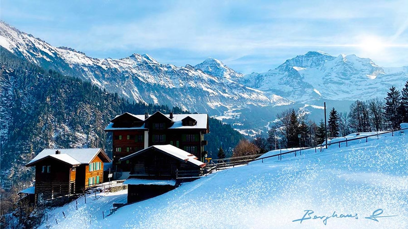 Photo hivernale du Berghaus Isenfluh enneigé dans les Alpes suisses, offrant une vue panoramique spectaculaire sur les sommets emblématiques de Eiger, Mönch et Jungfrau.